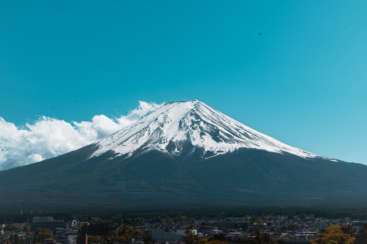 Mount fuji, japan, under a bright blue sky.